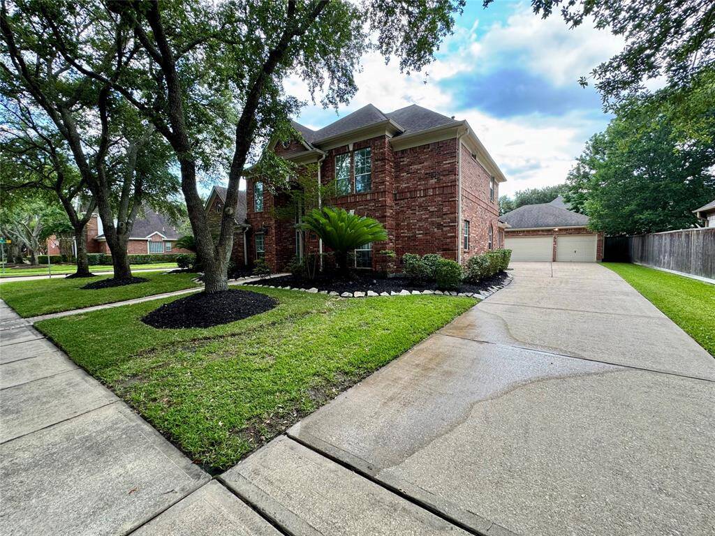 The extra-long driveway leads to the three car garage.