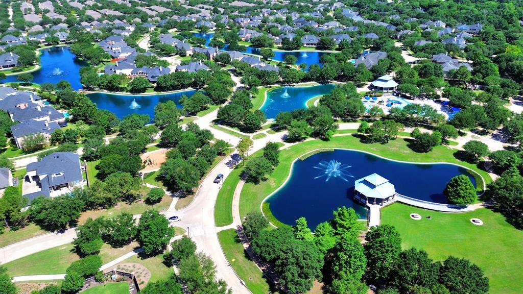 Grand Lakes offers an impressive lineup of amenities, including 27 stocked lakes for fishing and kayaking, full-sized tennis courts, four sparkling pools, a splash pad and spray park, a dog park, themed playgrounds, and scenic walking trails. You'll also enjoy peaceful pavilions, gazebos perfect for picnics or reading, and relaxing putting greens for a casual round.