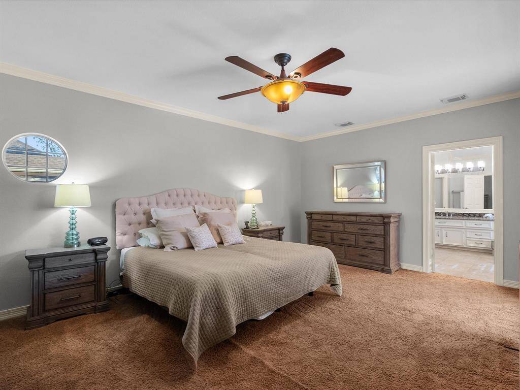 Welcome to the primary bedroom.  It's large enough to hold all of the furniture needs you have.