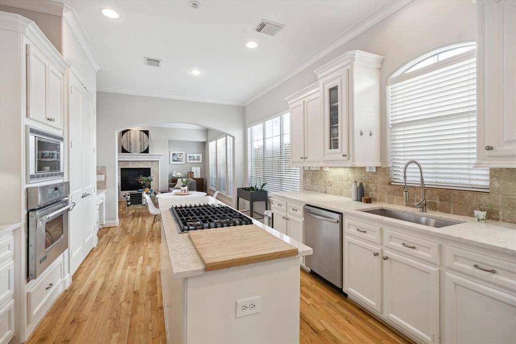 The large kitchen features tranquil views of the outdoors while you are preparing your favorite dishes
