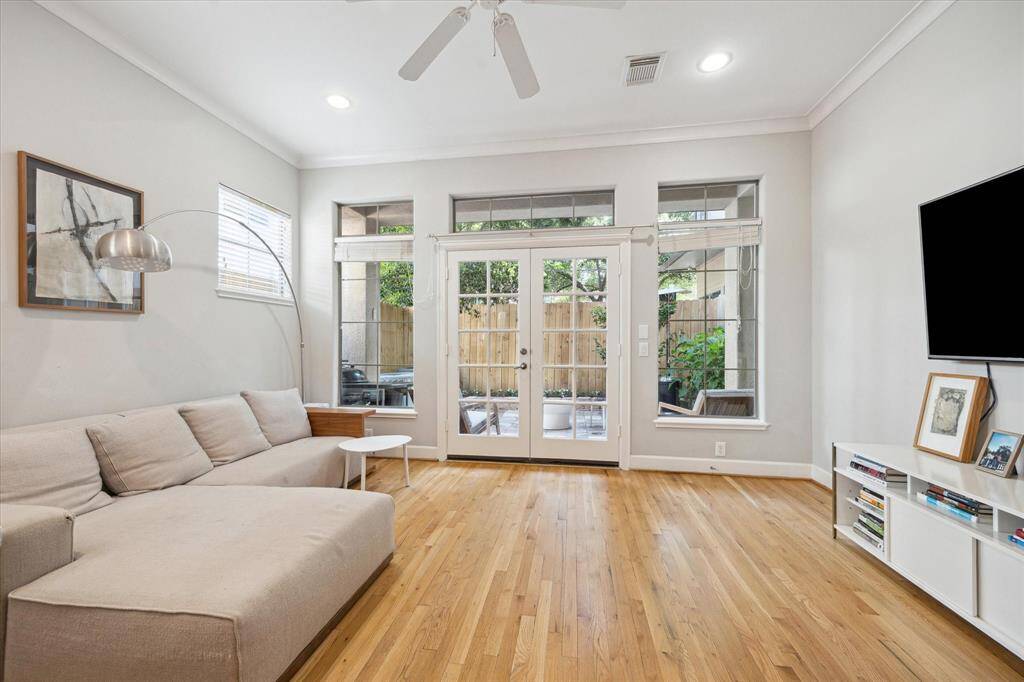 Charming French doors open onto the private patio for effortless indoor-outdoor living