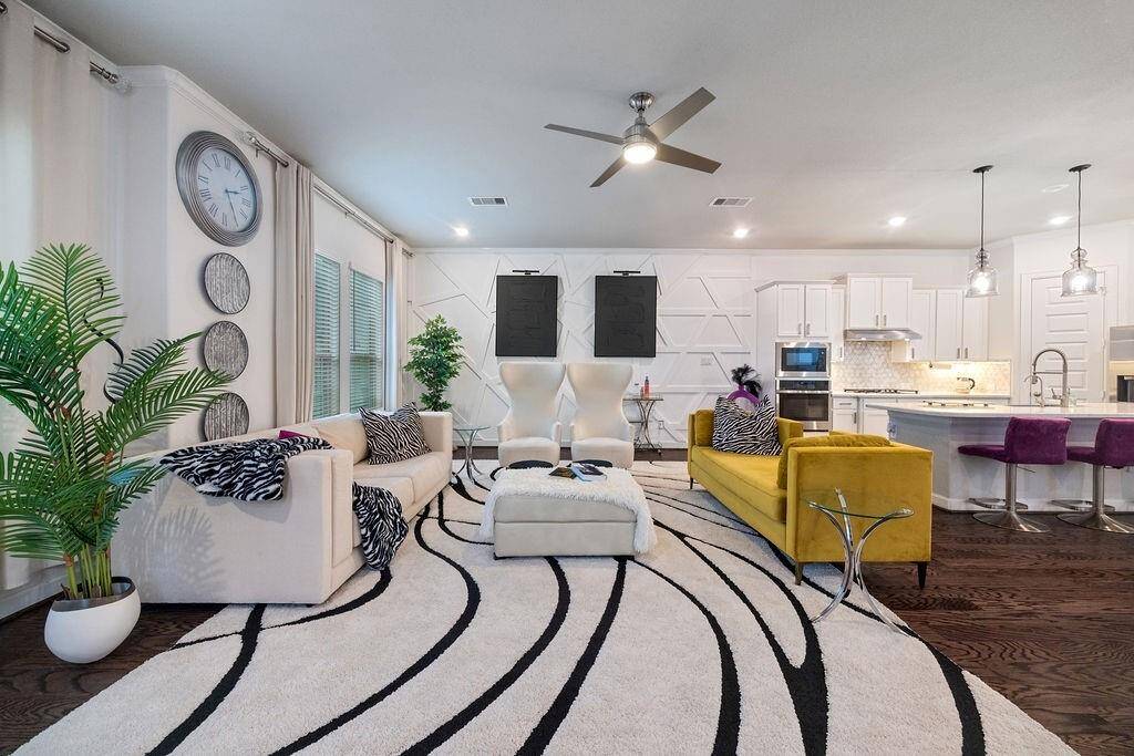 Second floor living area with kitchen and dining