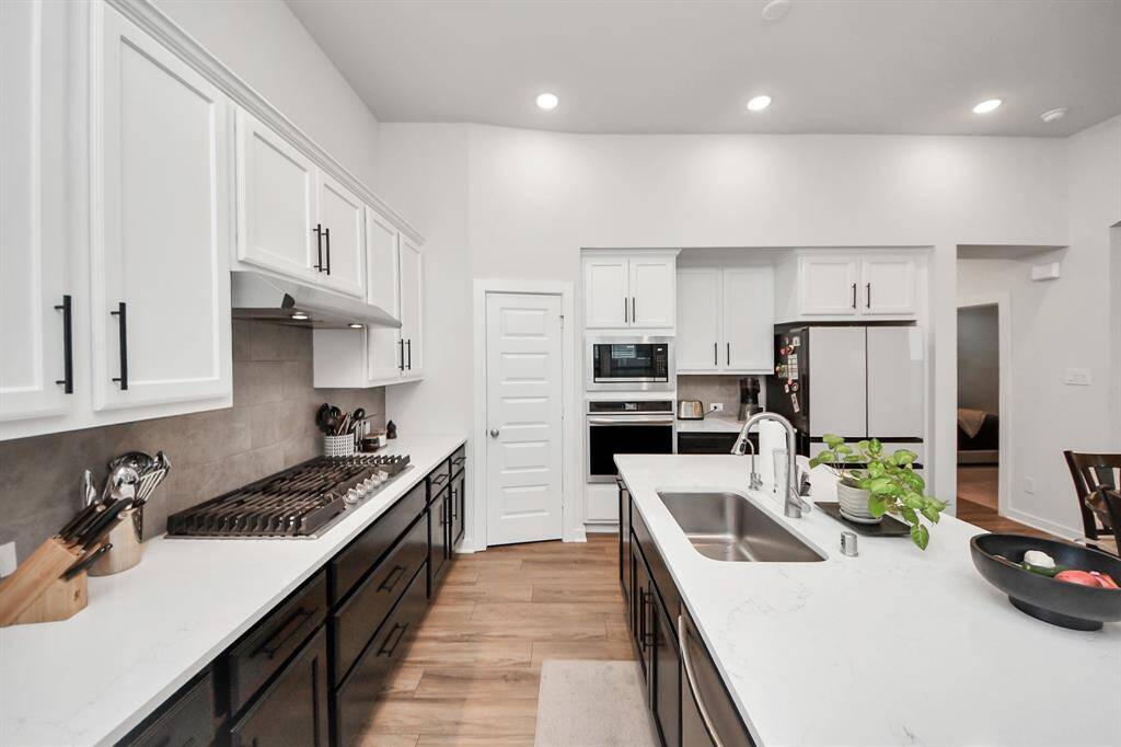 Five Burner Gas Stove makes cooking in this kitchen a dream.