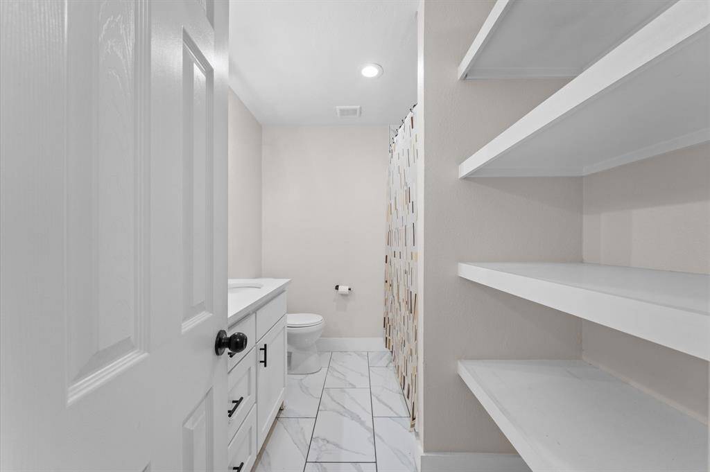 Beautifully updated bathroom with modern tile and sleek fixtures.