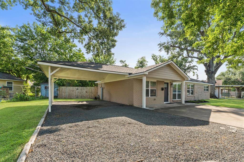 Charming corner-lot home with fresh exterior updates and a spacious 2-car carport.