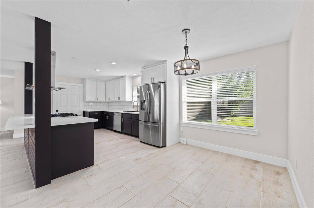 Open dining space seamlessly connected to the kitchen and living room.