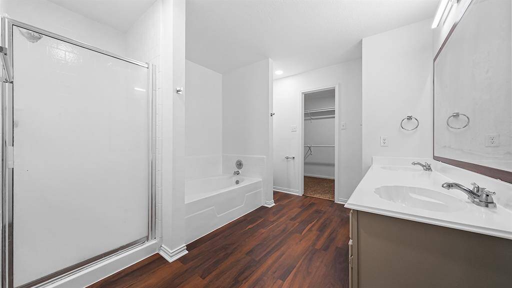 Alternative view of the ensuite bathroom showcasing the tiles shower, and entrance to the huge walk-in closet!