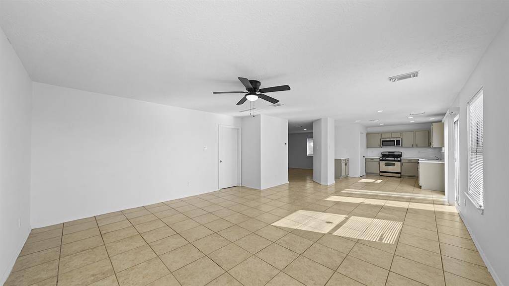 Huge open space adjacent to the kitchen is perfect for your dining area and family room!