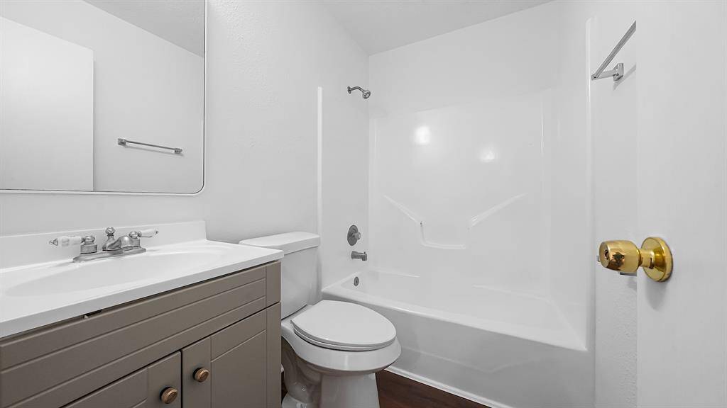 Secondary bedroom upstairs has updated vanity with storage!