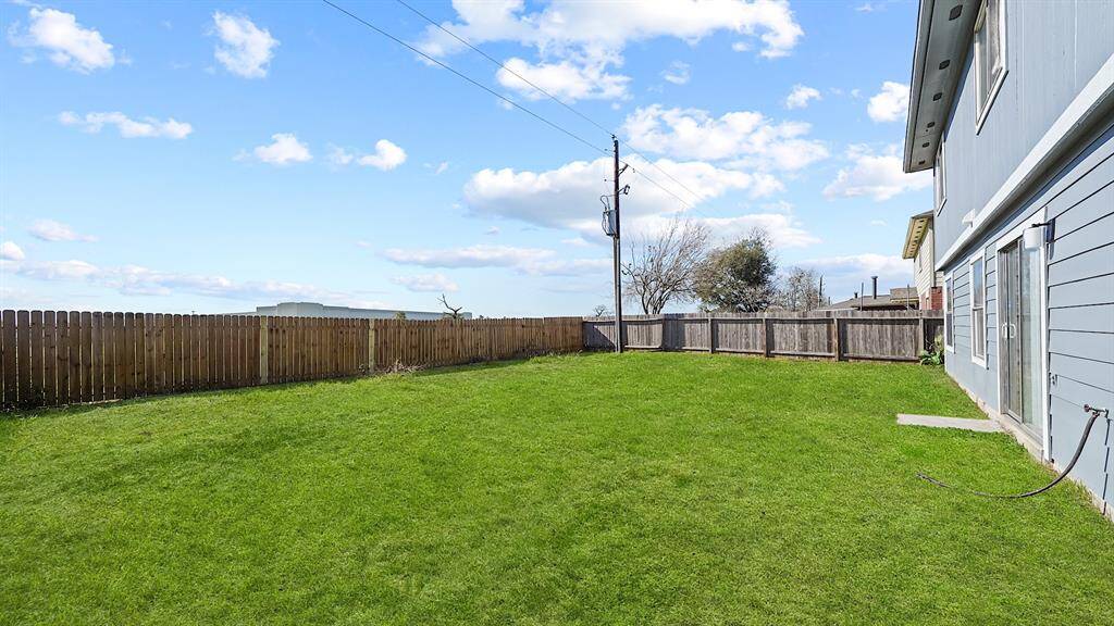 Step into your new oasis, where an impressive large backyard awaits, offering unparalleled privacy with no neighbors directly behind you.
