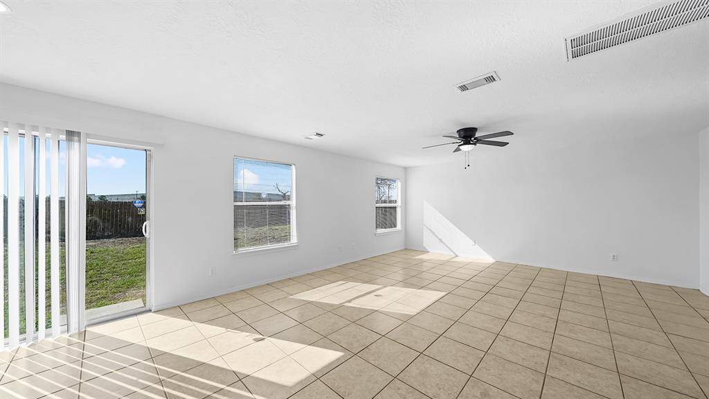 Sliding glass door allows views into the large backyard!
