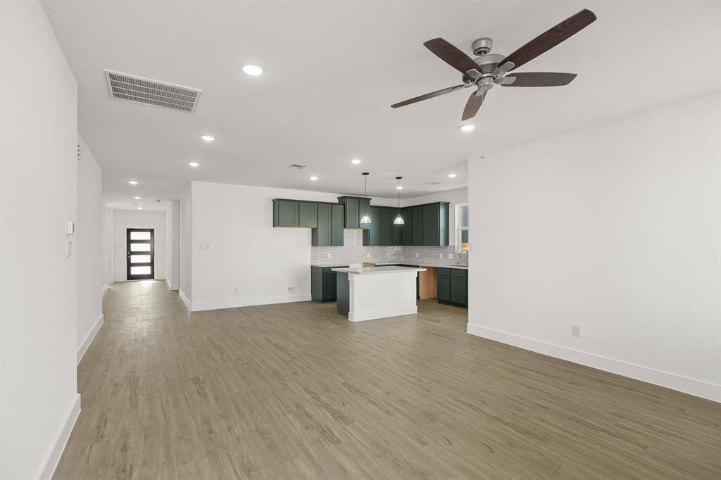 As you wander through the open floor plan, you’ll notice high ceilings that elevate the ambiance, while carefully chosen materials add a touch of luxury without losing that cozy feel.