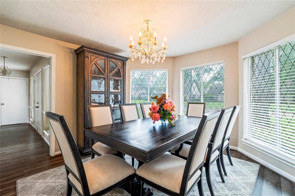 The formal dining room offers great natural light and plenty of space to gather, with views of the front yard.