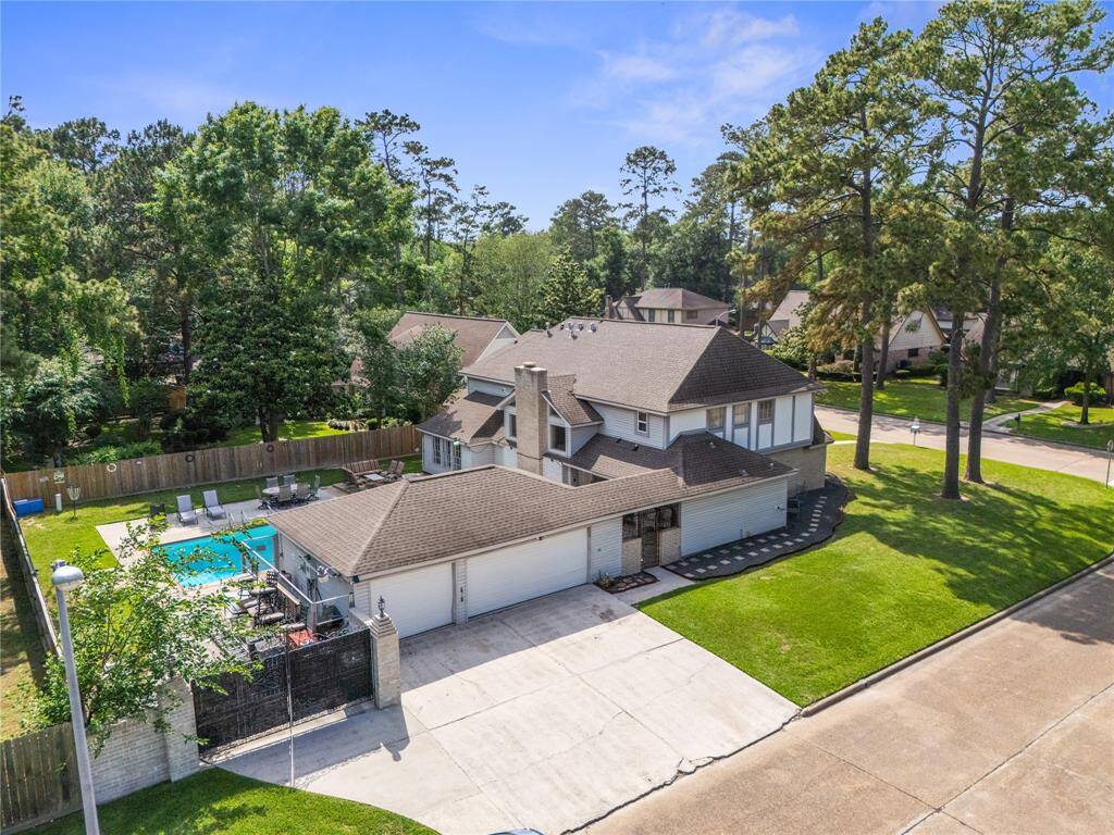 Oversized lot, detached garage, gated entry, and a full backyard experience tucked behind it all.