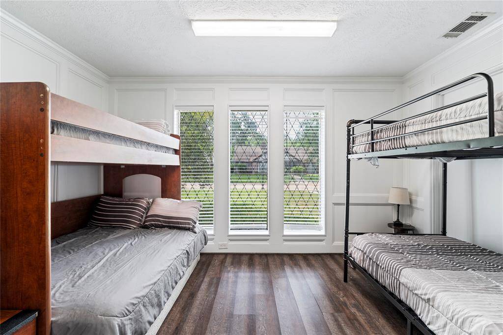 This light-filled room with large front-facing windows can serve as a comfortable bedroom, home office, or flexible space to fit your needs.