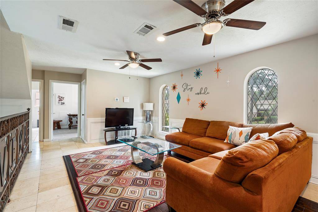 Spacious secondary living area upstairs with room to relax, watch TV, or entertain. Offers direct access to secondary bedrooms.