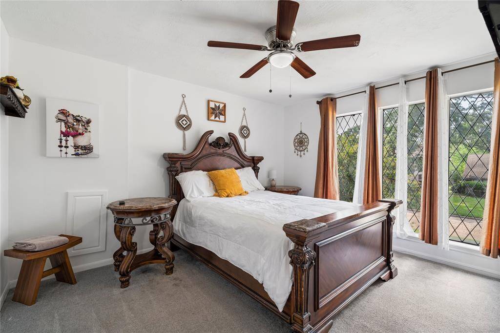 This upstairs bedroom offers a comfortable setting with space to unwind or personalize. Great for family, guests