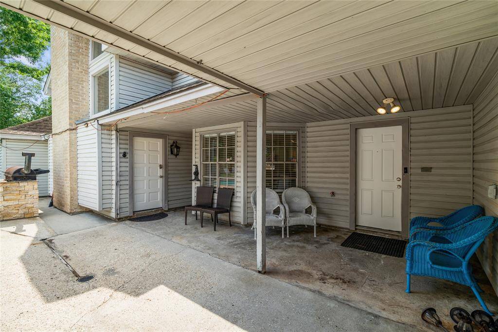 Covered patio space right off the pool, perfect for shaded seating or weekend hangouts. Multiple access points make it easy to move between inside and out.