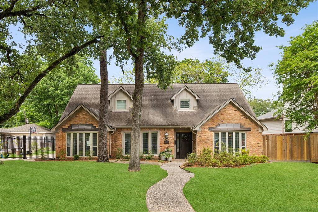 Experience the allure of this beautifully situated home on a sprawling 16,500 square foot ravine lot in the desirable North section of Walnut Bend.
