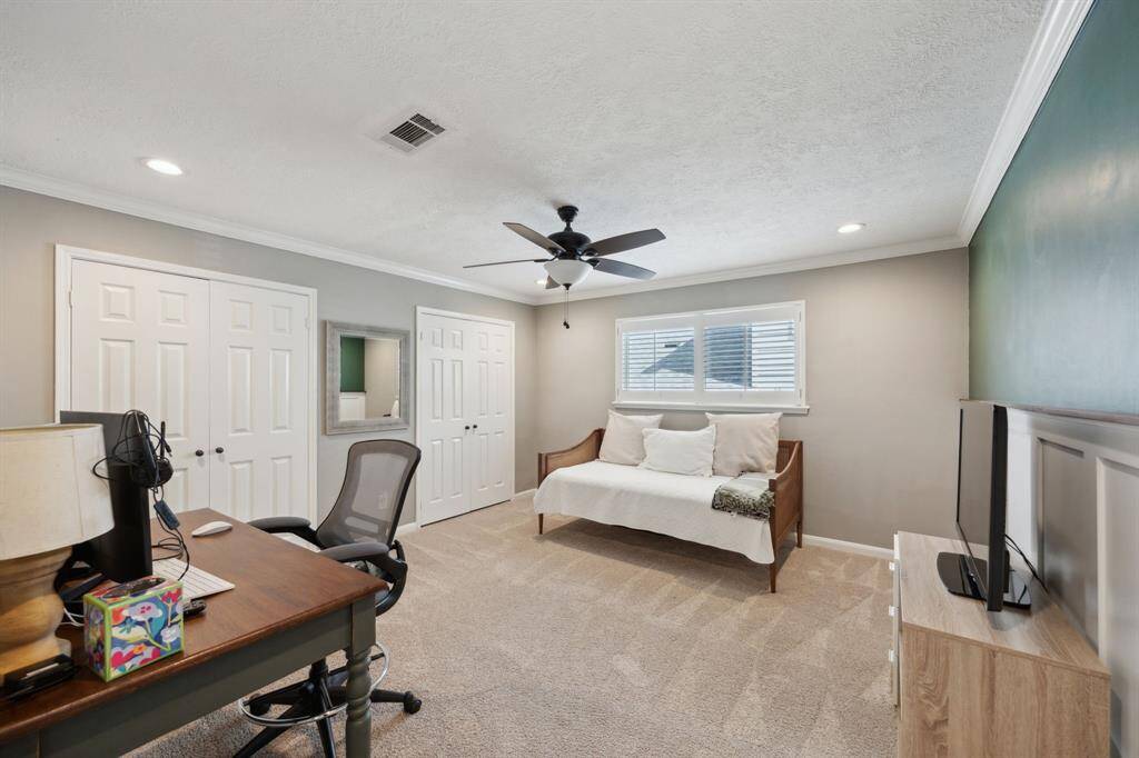 The largest of three bedrooms on the second floor features recessed lights, two closets, and Plantation shutters.
