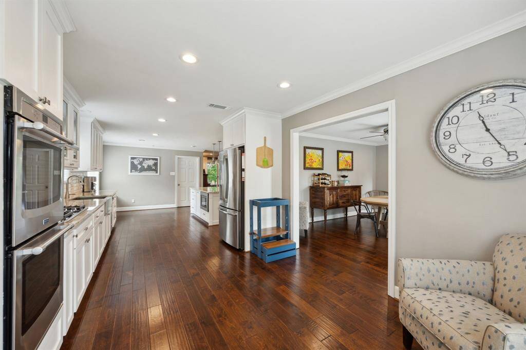 Tons of prep and storage space in the island kitchen. Note the ease of access to the formal dining room.