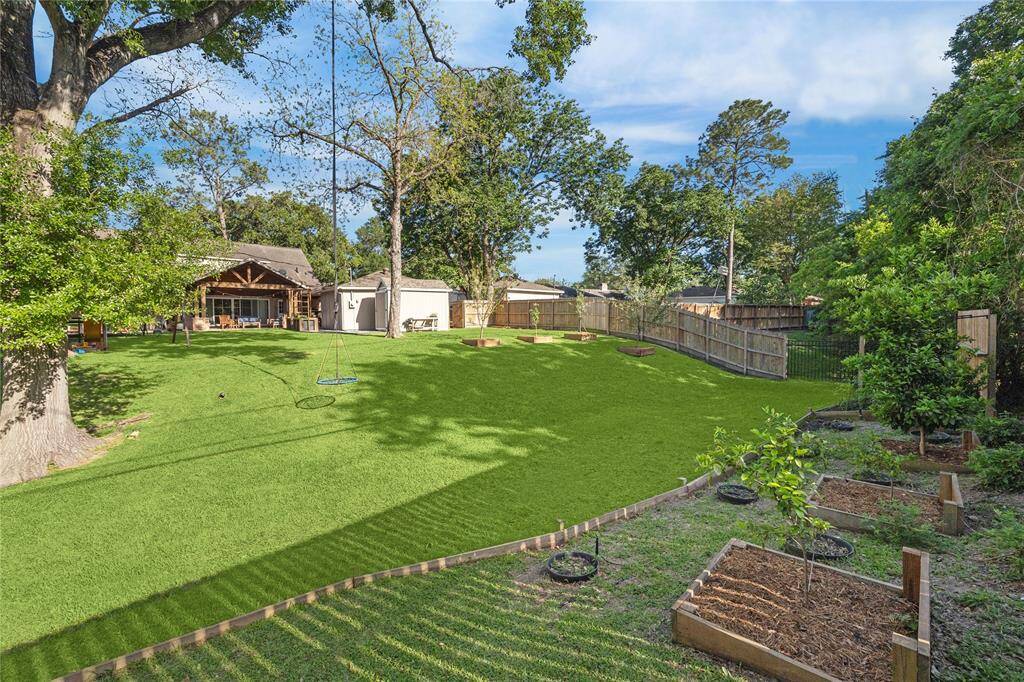 The backyard provides endless room to run and play. There is plenty of room for a future pool!