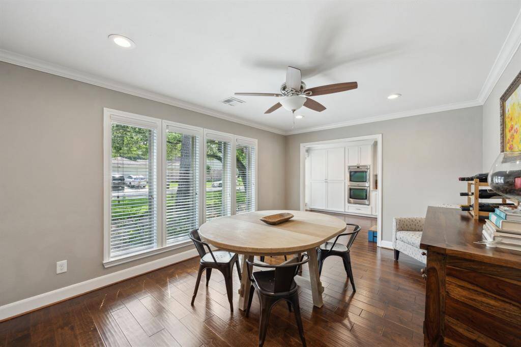 Formal dining room at the front of the home with tons of natural light, recessed lighting, and crown molding.