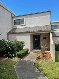 Front Entry with pretty flower beds.