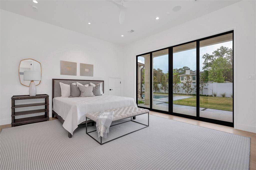 [1st-Floor En Suite Bedroom/ Flexible Space]Furnished as an en suite bedroom, this space would also serve as a pool/gameroom with pool bath (bath has an exterior door).