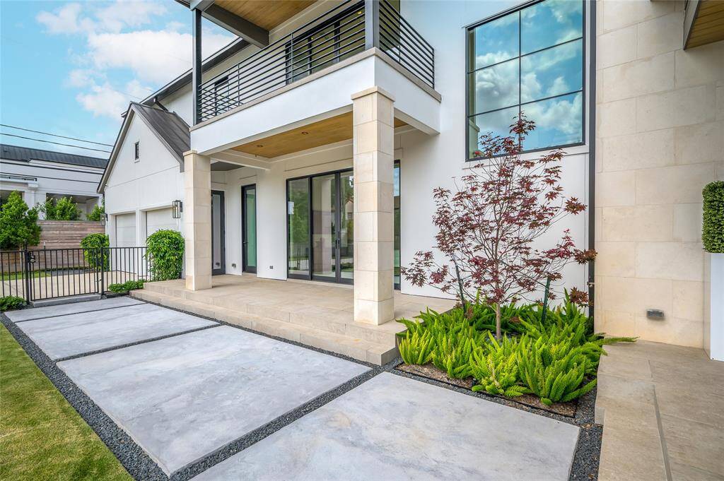 [Exterior Patio connected to 1st-Floor Bedroom/Flexible Space]Slider glass doors access this patio from the downstairs bedroom. Opaque (frosted) glass door at left opens into the en suite bath, offering the option as a pool bath.
