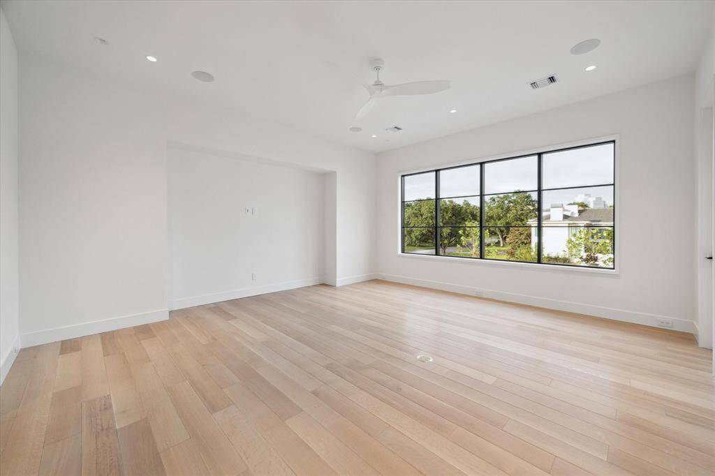 [Gameroom]Positioned on the second floor, the gameroom overlooks the pool and patios. Amenities include a Zephyr beverage chiller, recessed wall for media, and built-in speakers.