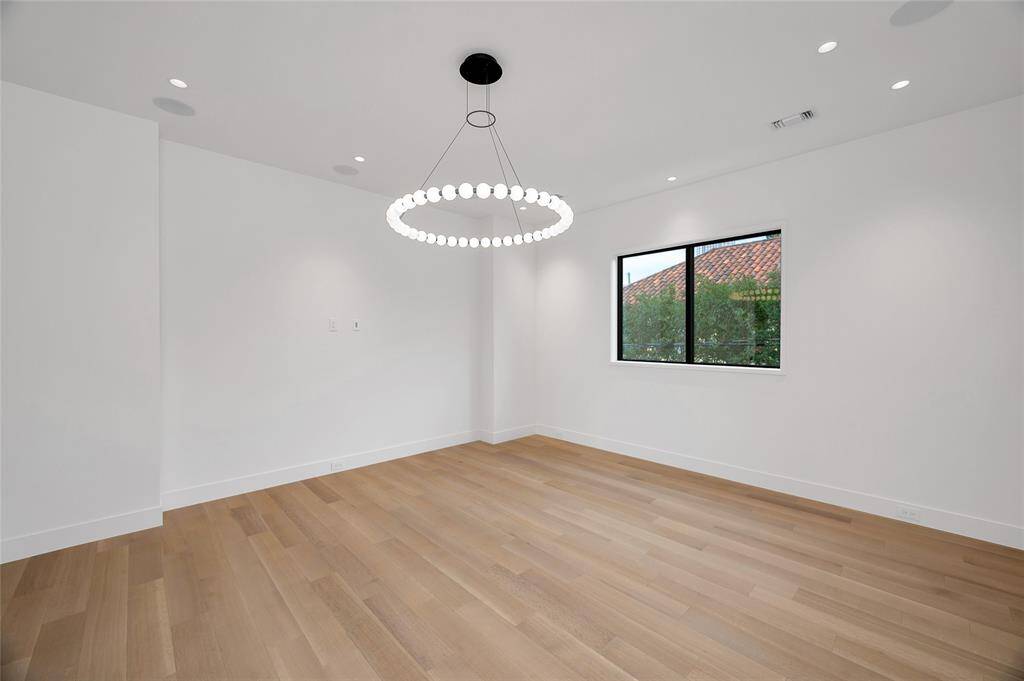 [Media Room]Adjoins the gameroom. Amenities include built-in speakers, a recessed wall for media, and pocket-doors.