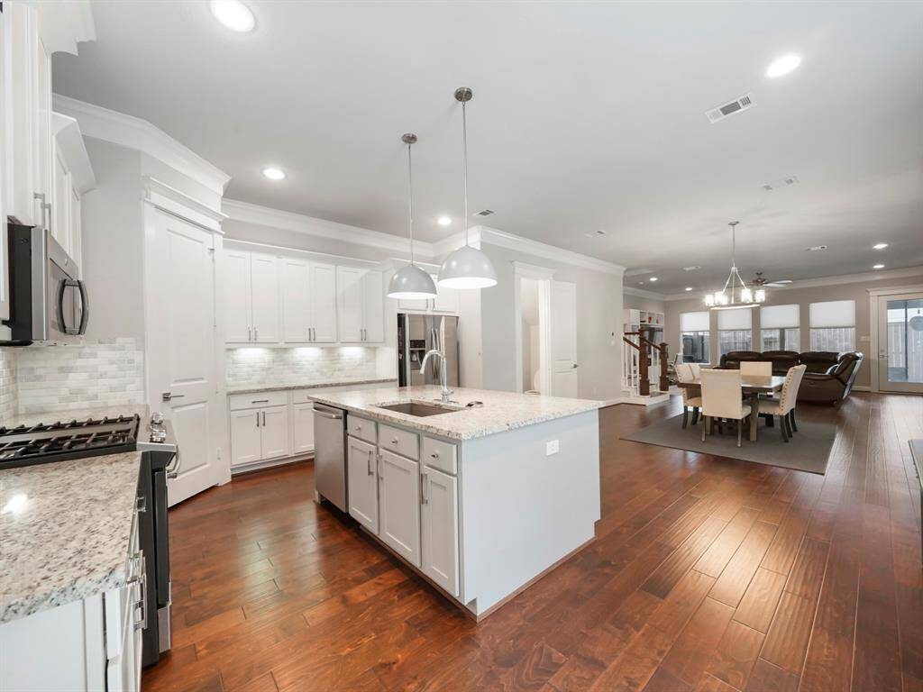 Spacious kitchen with lots of counter space and storage.