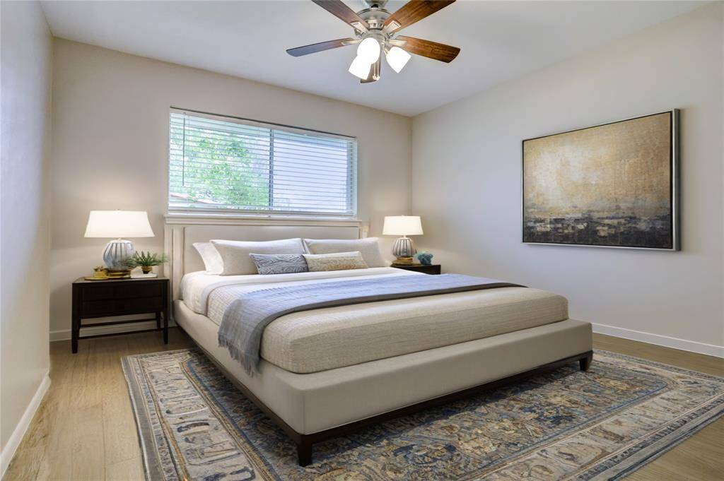 The third bedroom, overlooking the backyard, is virtually staged as a guest room but offers space and a multitude of uses.