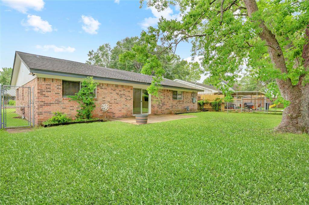 The spacious backyard offers a quiet and private space to relax or entertain.