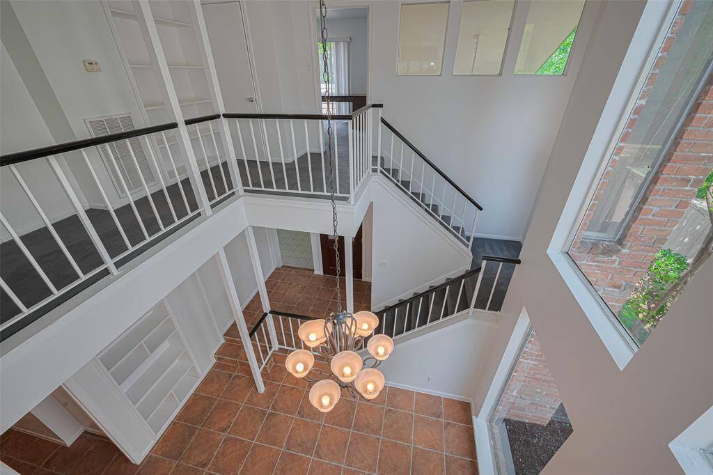 The primary bedroom even has a small balcony looking down over the dining room. Don't worry, there are doors to help maintain privacy!