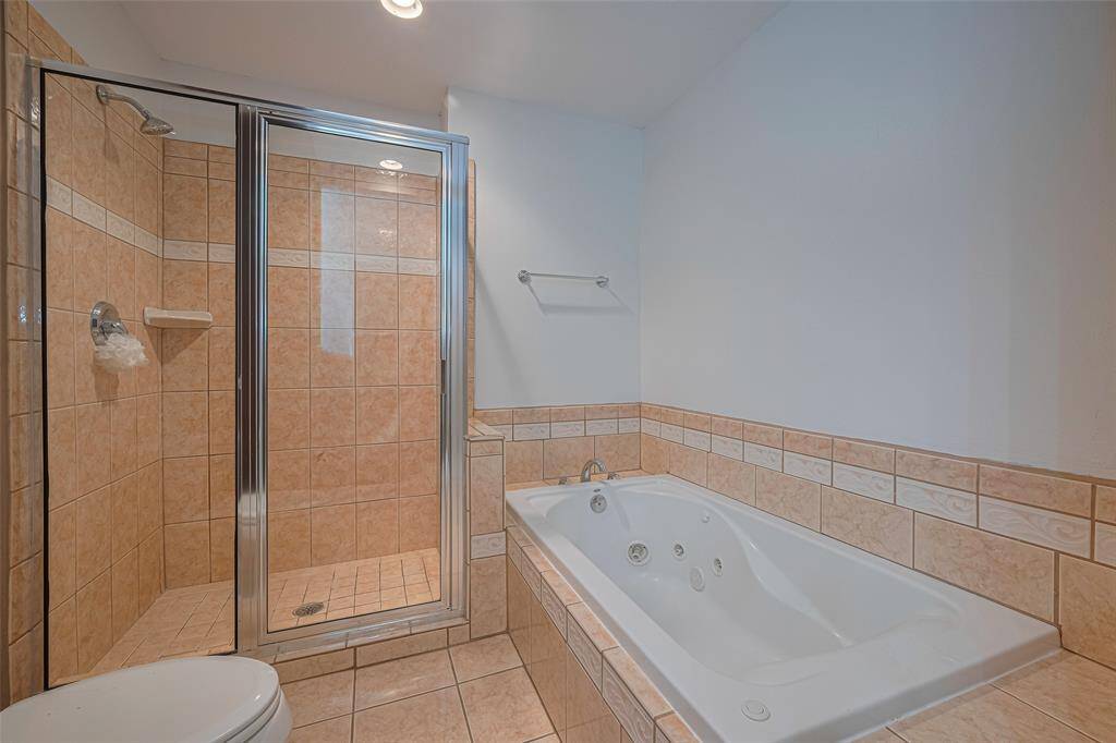 The primary bath features a separate shower and tub.