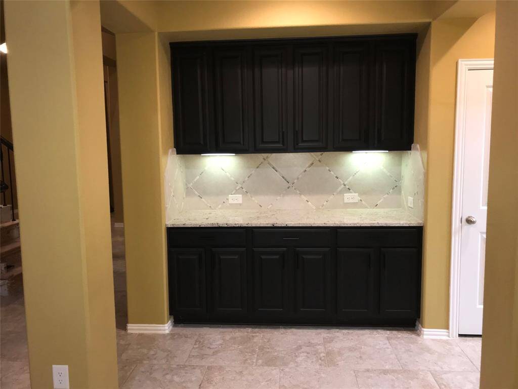 More Views of the High Ceiling Family Room from the Gourmet Kitchen
