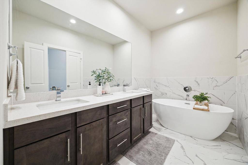 Check out the stunning finishes in the primary bathroom shower — a sleek, modern design that adds a touch of luxury.
