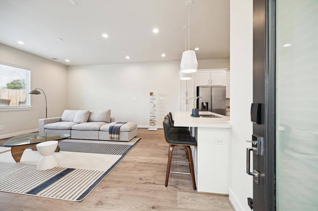 View of the modern kitchen featuring beautiful countertops and sleek finishes