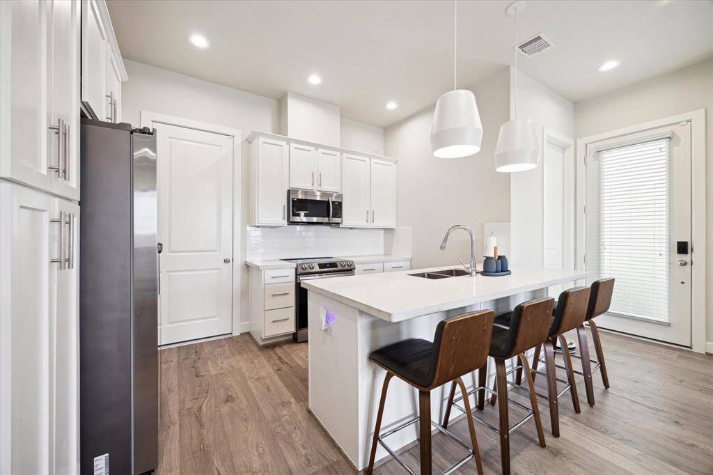 Outfitted with brand new electric stainless steel appliances — ready to handle all your cooking needs in style