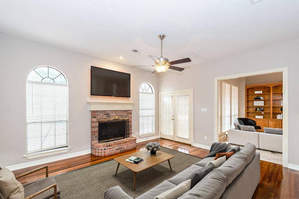 2nd living room-virtual staged looking into main living room.