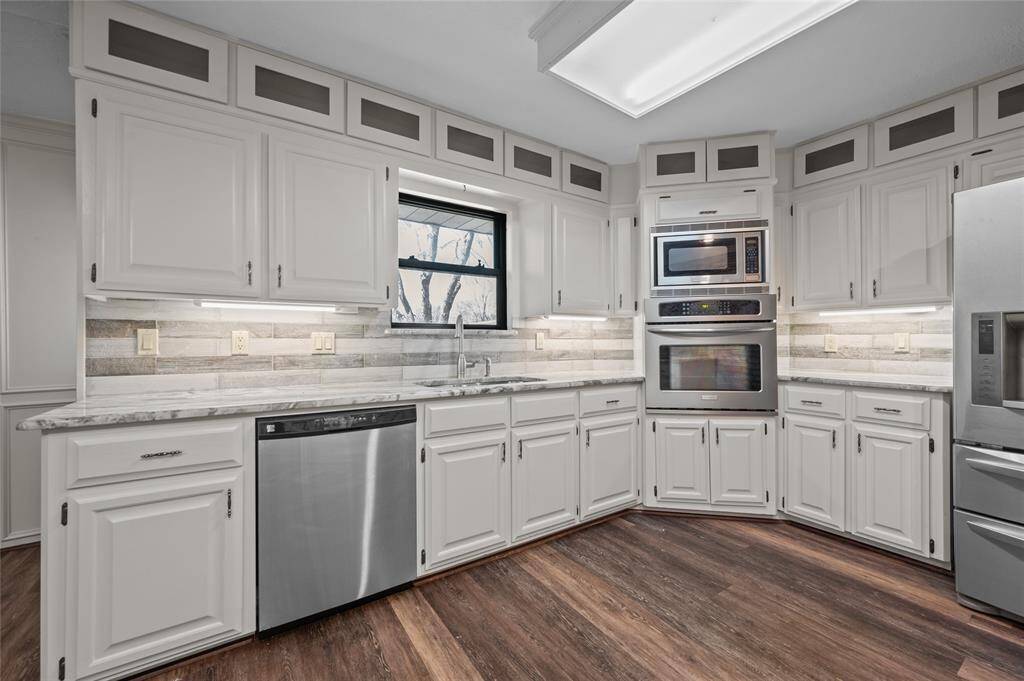 Spacious kitchen with stainless steel appliances.