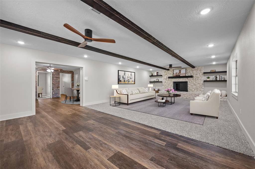 Large family room with beautiful ceiling beams.