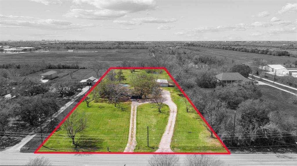 Aerial view of property. Red lines are estimates only of the property lines. Please refer to the survey for exact dimensions.