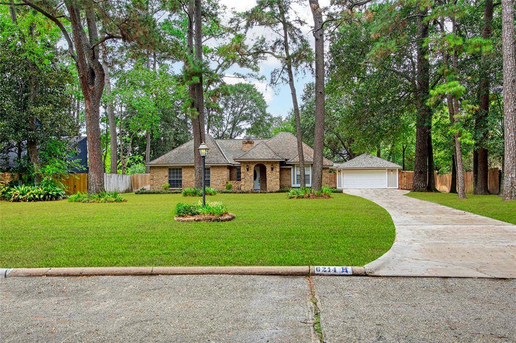 Welcome to 6214 Oak Masters: An elegantly crafted residence nestled among mature trees, offering a serene living experience with lush landscaping and a spacious, private yard. This charming home boasts a timeless design with a modern touch, complete with a sweeping driveway leading to a detached two-car garage. Discover your dream home in this tranquil neighborhood setting.