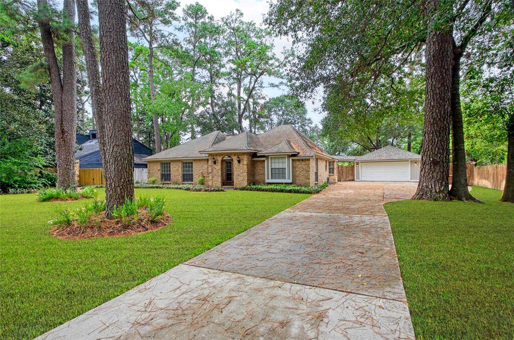 Expansive driveway leading to hidden storage perfect for RVs or boats.
