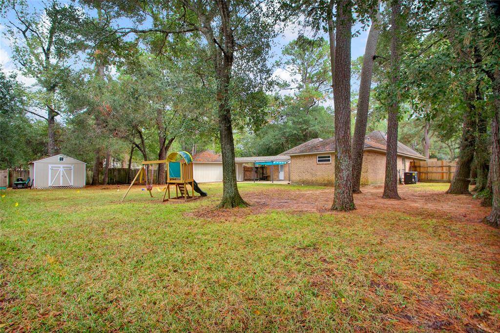 Includes a convenient storage shed; playground shown not included.