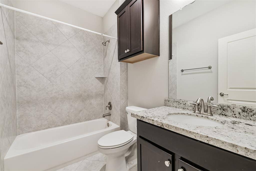 First floor full bathroom with shower/tub combo and great vanity and linen storage.