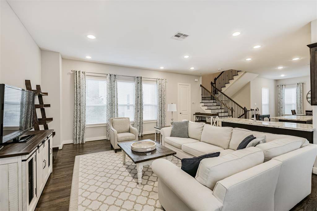Living room is spacious enough for a sectional or large couch set!